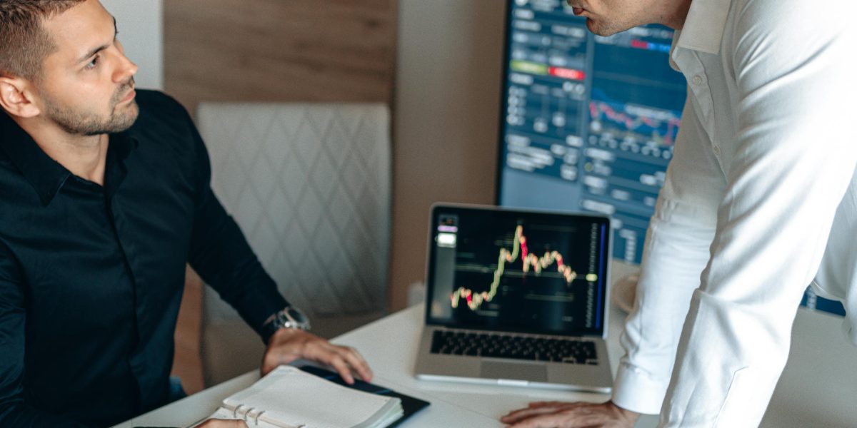 Investors engaged in a discussion, using data-driven insights to evaluate potential startup opportunities.
