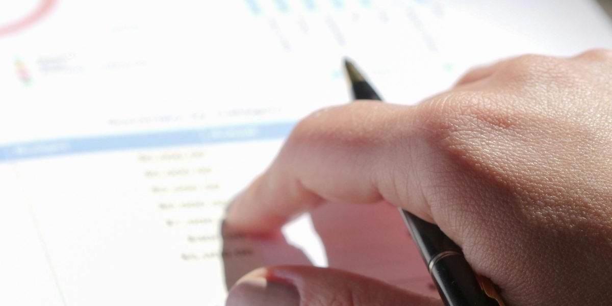 A person carefully reviewing financial documents, emphasizing the importance of understanding investment terms and regulations.