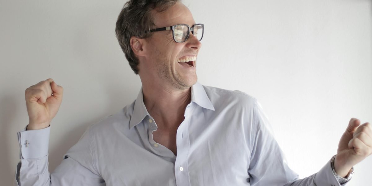 A confident founder celebrating a significant milestone or achievement, reflecting successful growth.