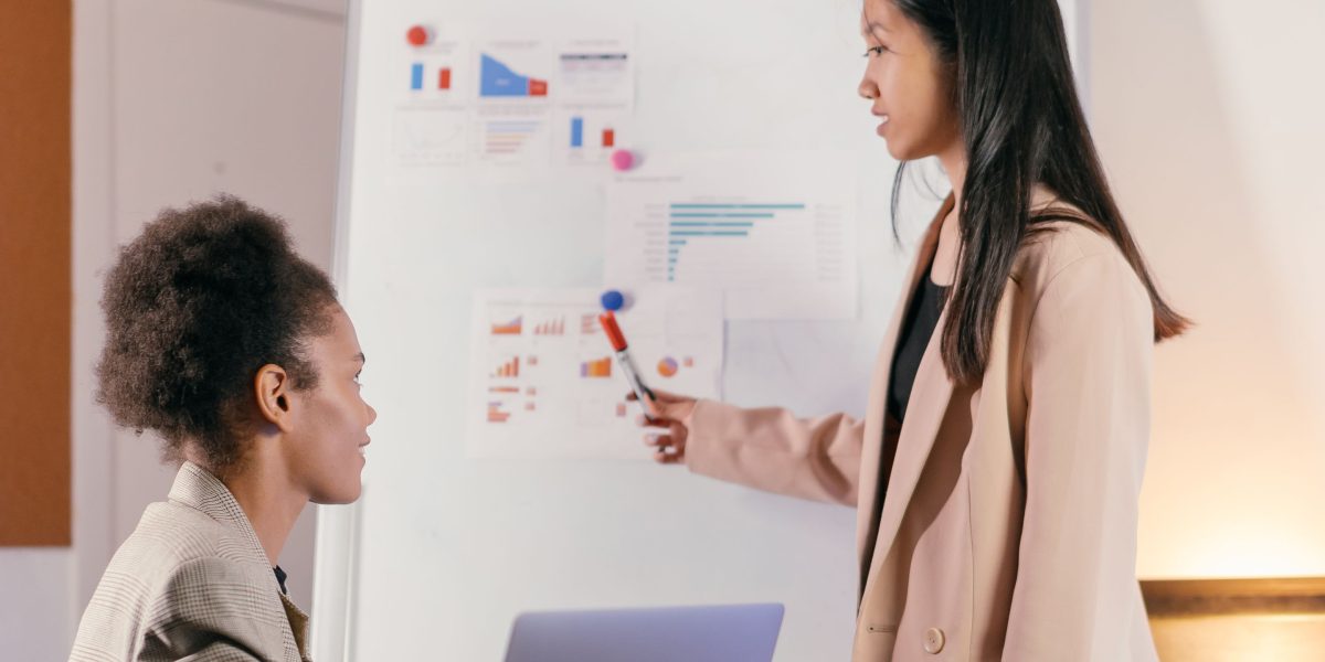 A diverse team collaboratively brainstorms new product concepts, leveraging generative AI to accelerate the idea generation phase.