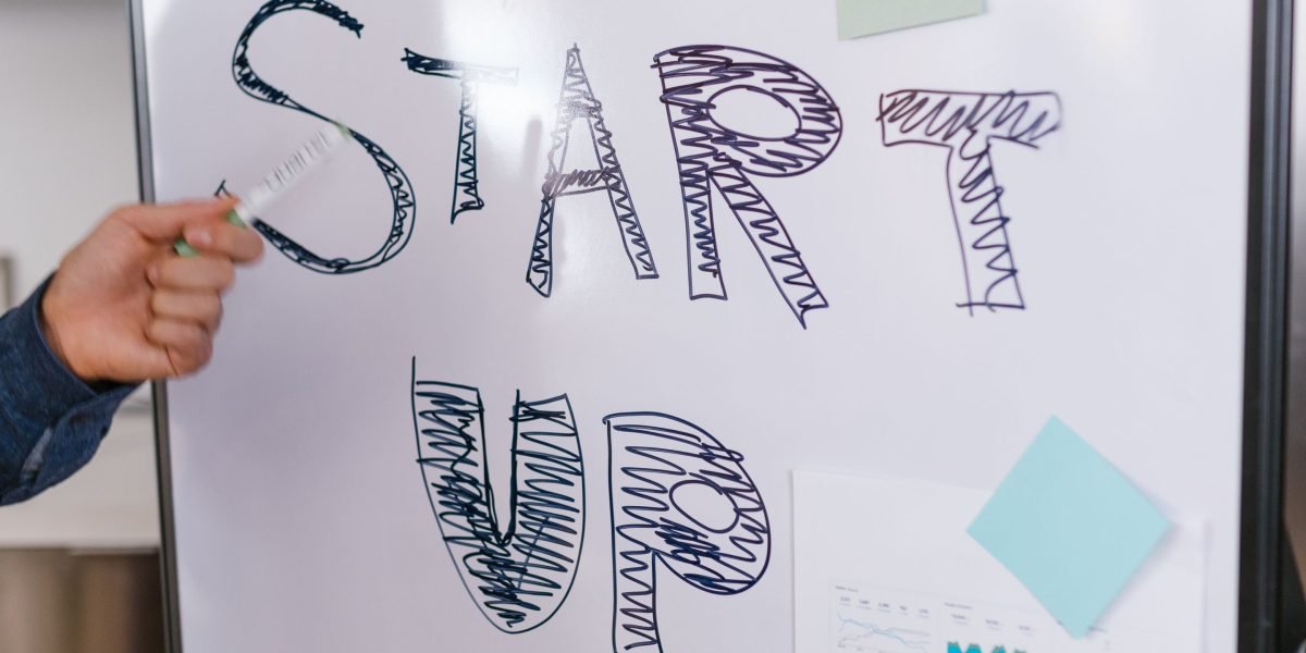 A diverse startup team actively discussing strategies for growth, empowered by new tools.