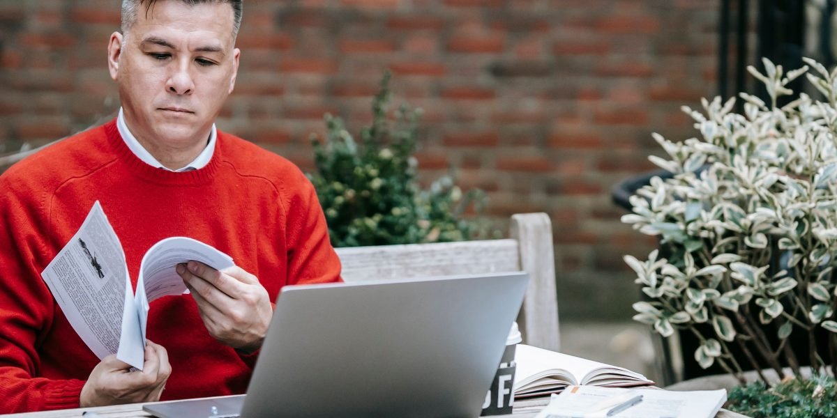 A business leader reviewing documents related to data privacy and compliance for AI integration.