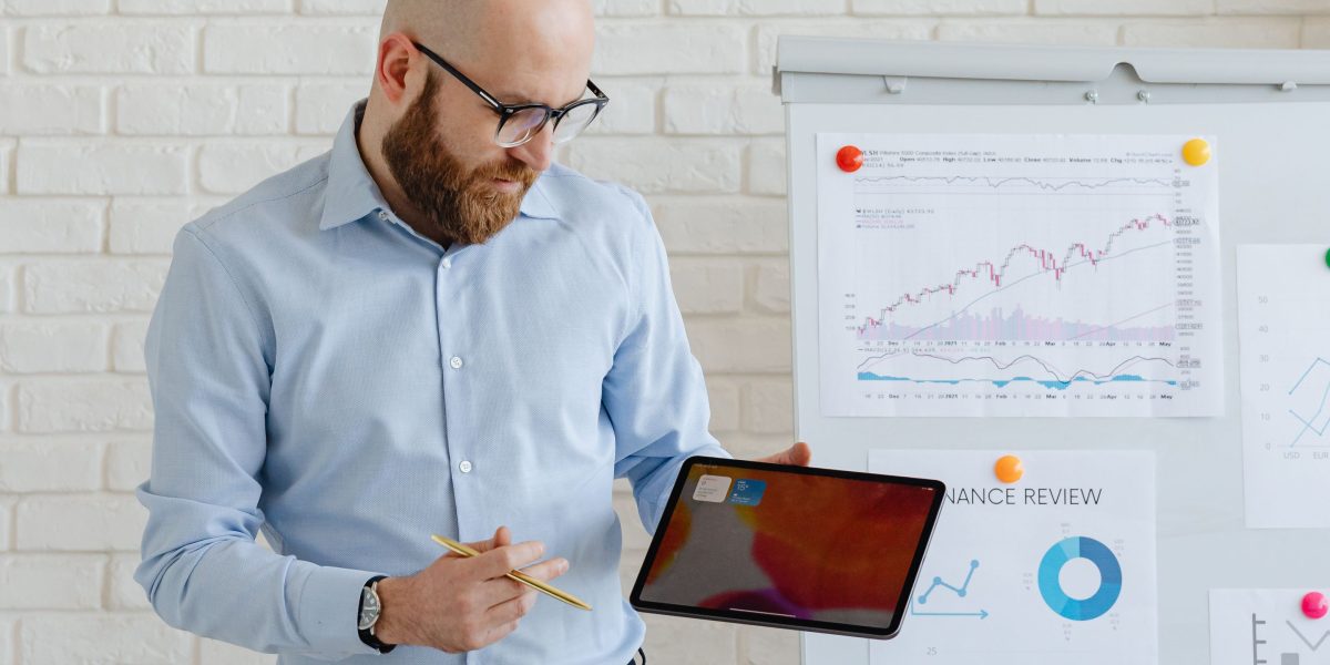 An individual confidently presenting growth strategies and market opportunities to a focused audience.