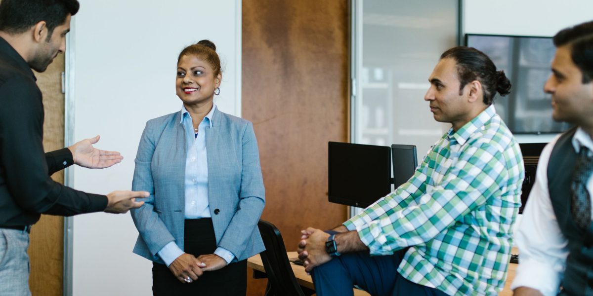 A team of professionals intently discussing potential business risks and future strategies.