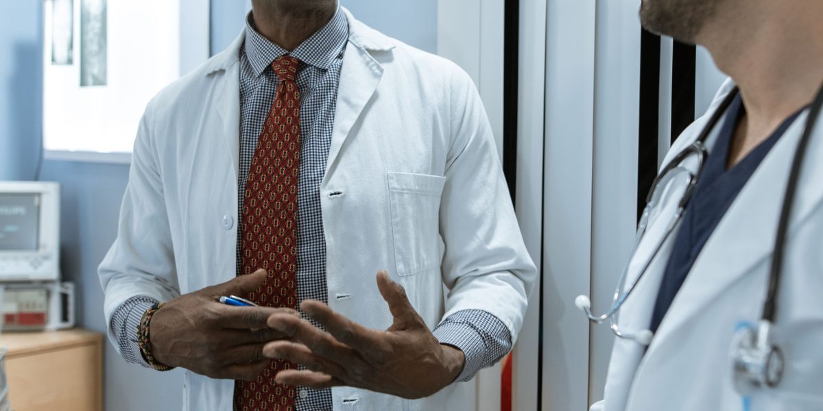 Healthcare professionals using modern tools to provide care, highlighting human-centric advancements.