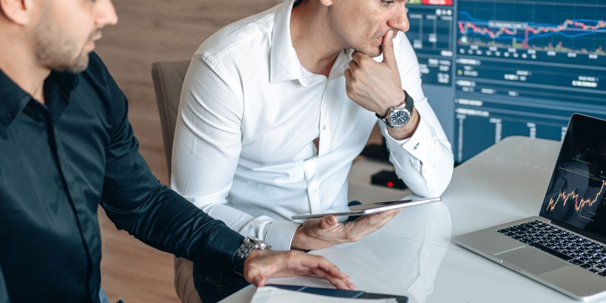 Business professionals analyzing market intelligence and competitive data, enabled by AI insights.