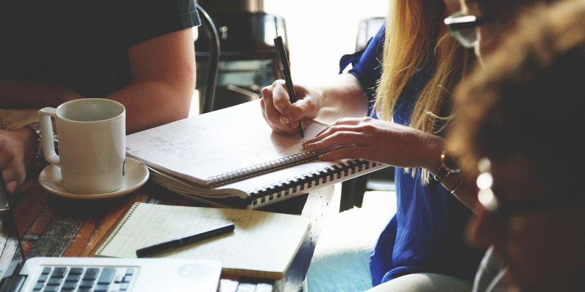 A founder actively brainstorming, sketching out ideas to find a clear path to funding and opportunity.