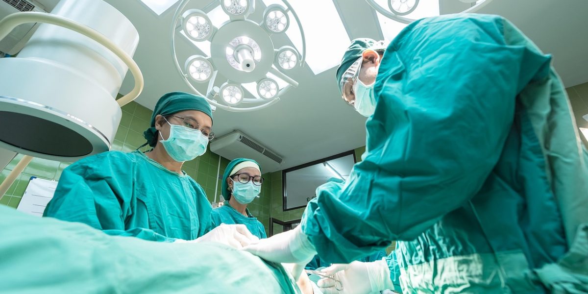 Medical professionals collaborating on digital data, illustrating the application of AI in healthcare research.