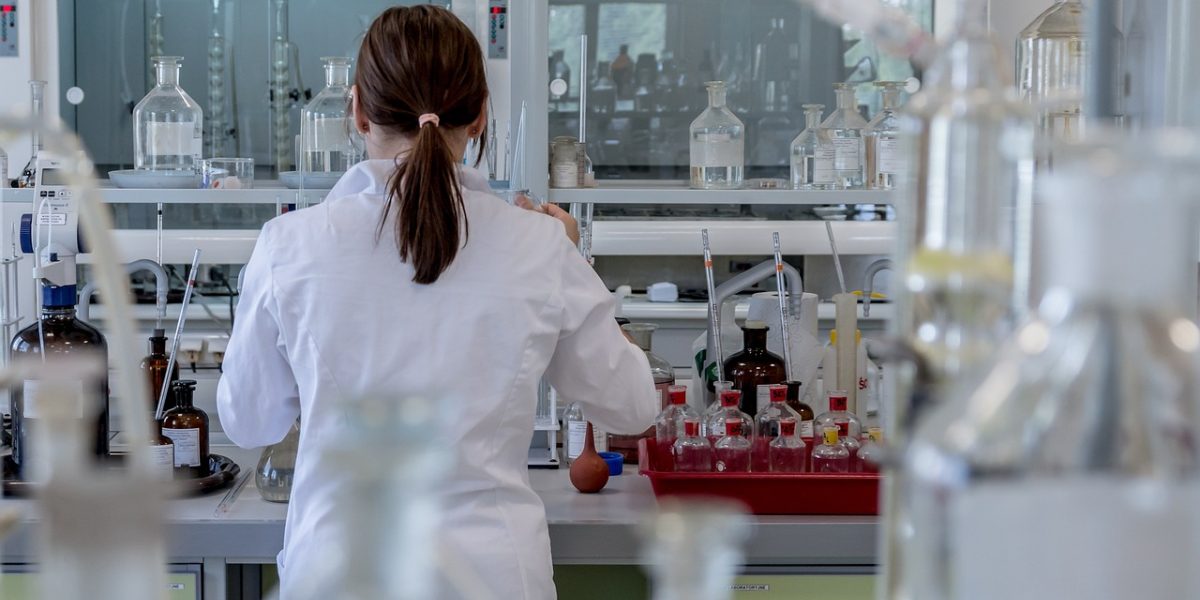 Scientists collaborating in a modern laboratory setting, symbolizing advancements in AI-driven drug discovery and health tech.