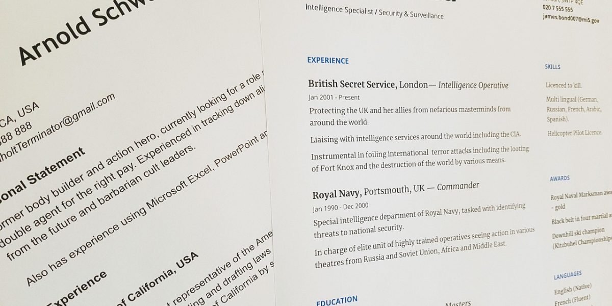 A recruiter thoughtfully examining a candidate's portfolio during a job interview, highlighting the importance of practical work.