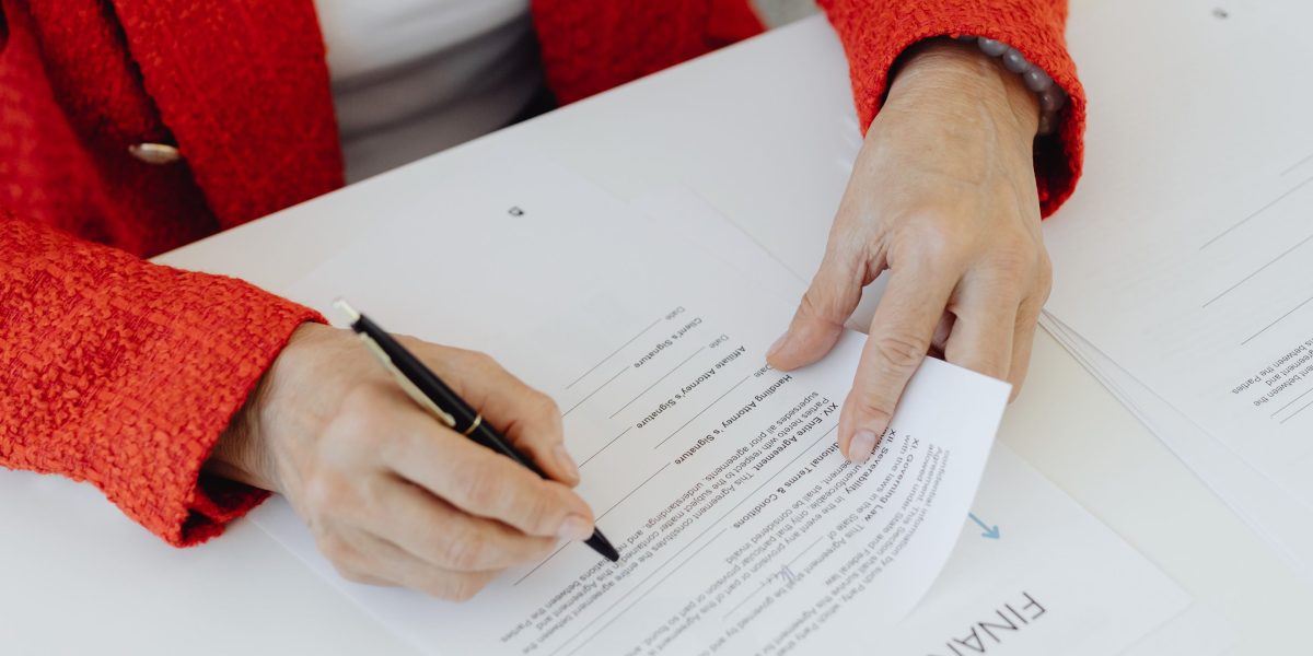 A person diligently reviewing documents, symbolizing the legal checks required for a firm name.