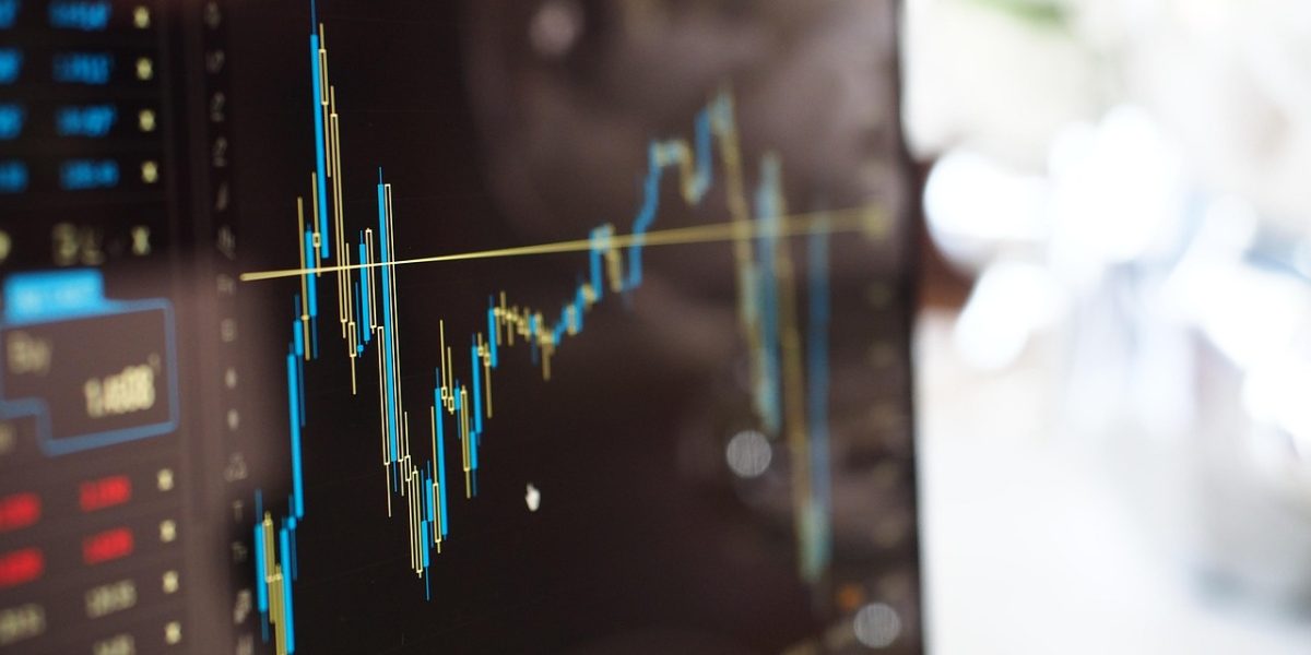 A business professional attentively reviewing market trends and data, symbolizing strategic decision-making.