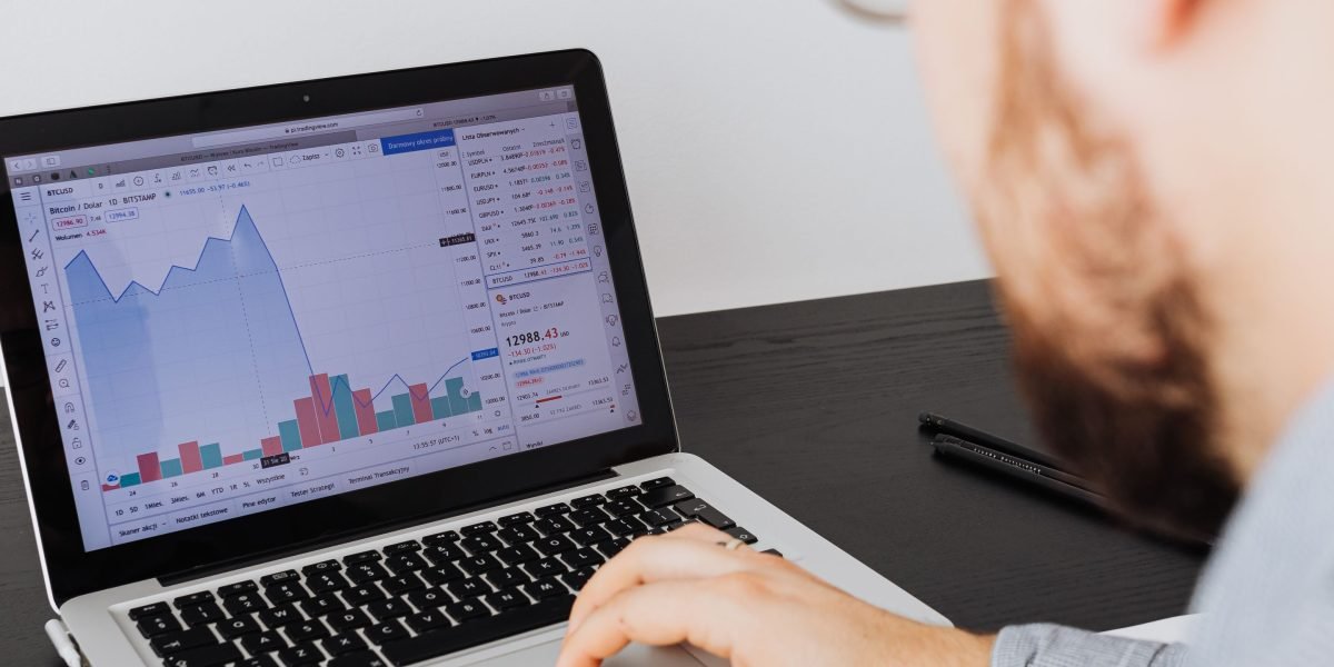 A professional scrutinizing data on a dashboard, symbolizing the diligent analysis required to assess tech centers.