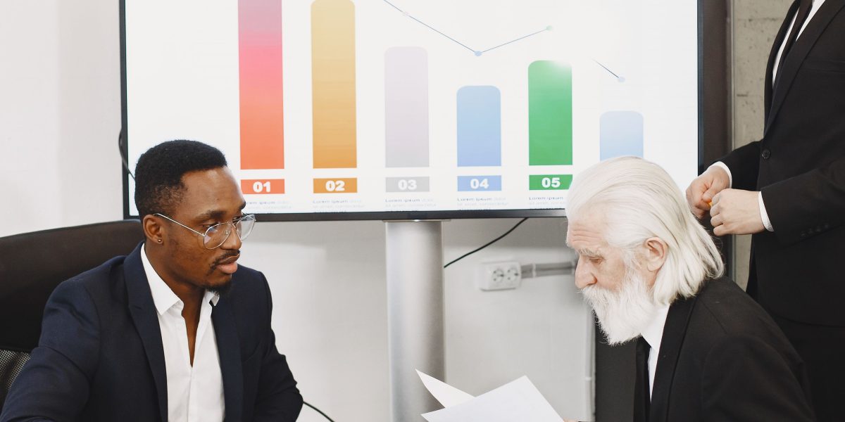 Business professionals engaged in a strategic discussion about growth and financial planning.
