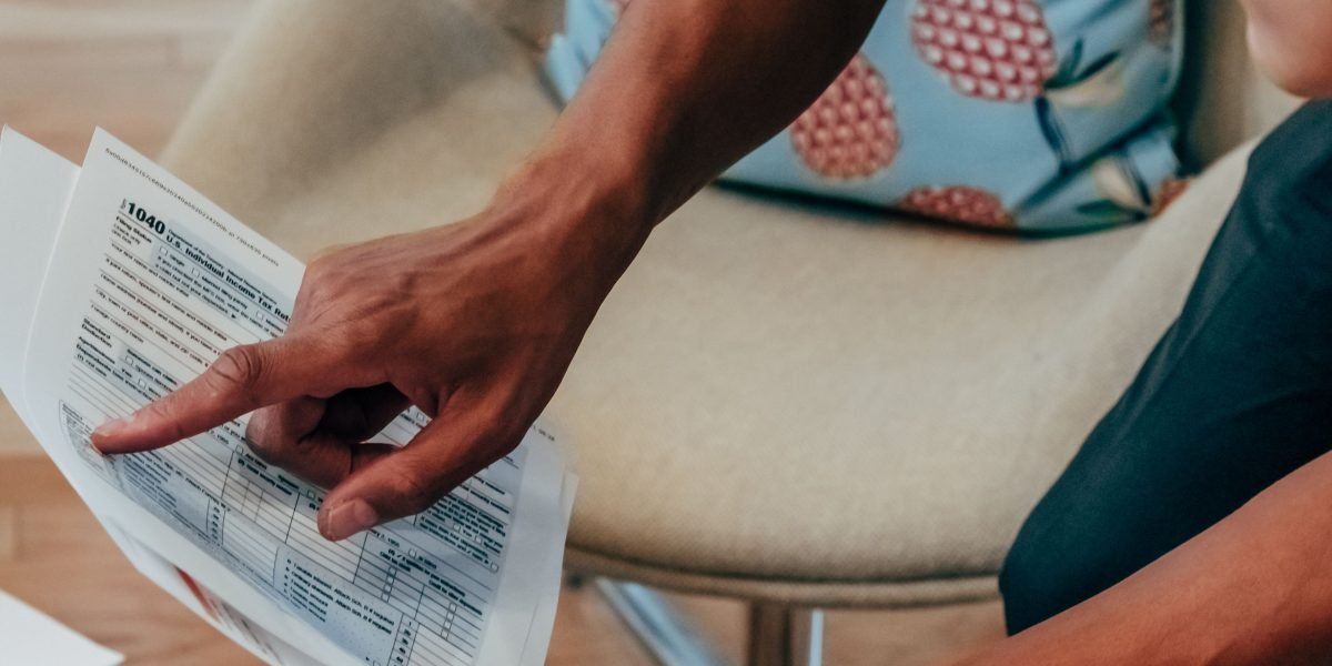 An investor meticulously reviewing financial documents and data as part of their due diligence process.