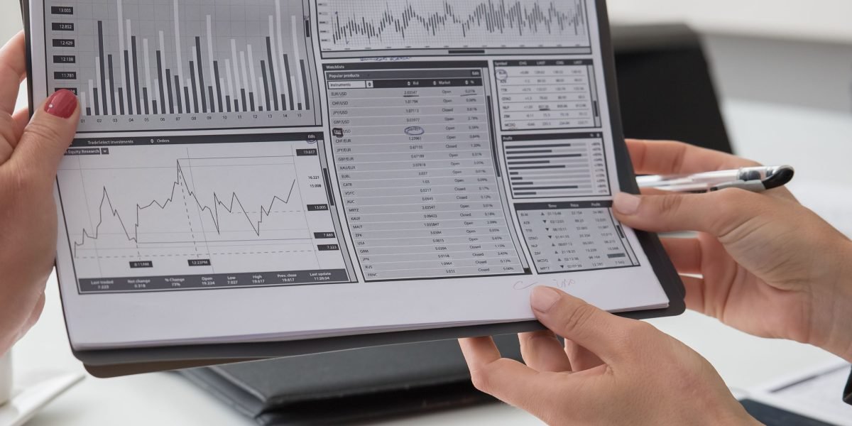Investors analyzing market trends and financial data to make informed decisions on specialized sectors.