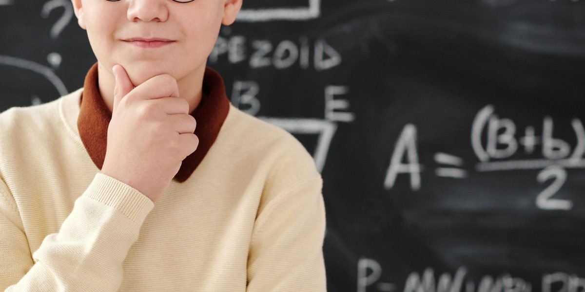 An individual reviewing data, deep in thought, demonstrating the process of critical analysis and comprehension.