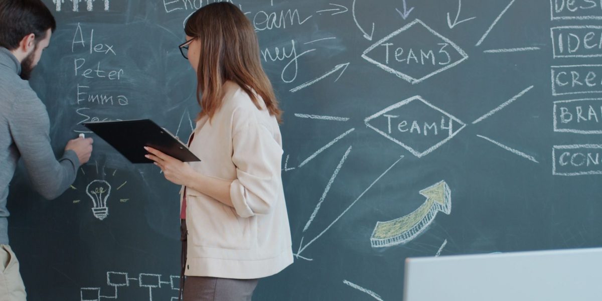 Professionals collaborate around a table, symbolizing strategic discussions driven by data insights in the startup world.