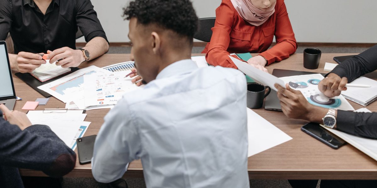 A diverse team collaboratively works on a project, illustrating the practical application of advanced data science techniques.