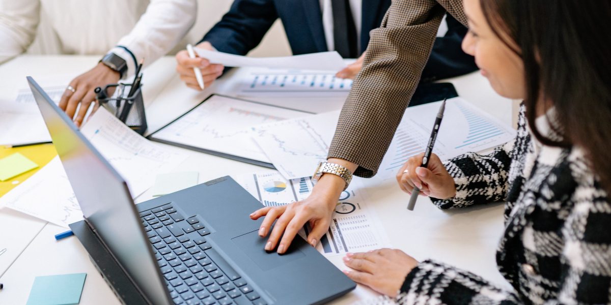 A team actively collaborating, representing the interconnectedness of a thriving tech ecosystem.